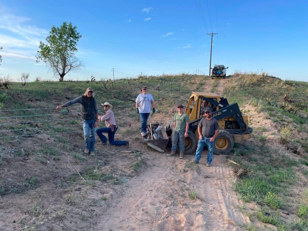 Texas Slim (far left) and volunteers installing fence near Pampa, TX